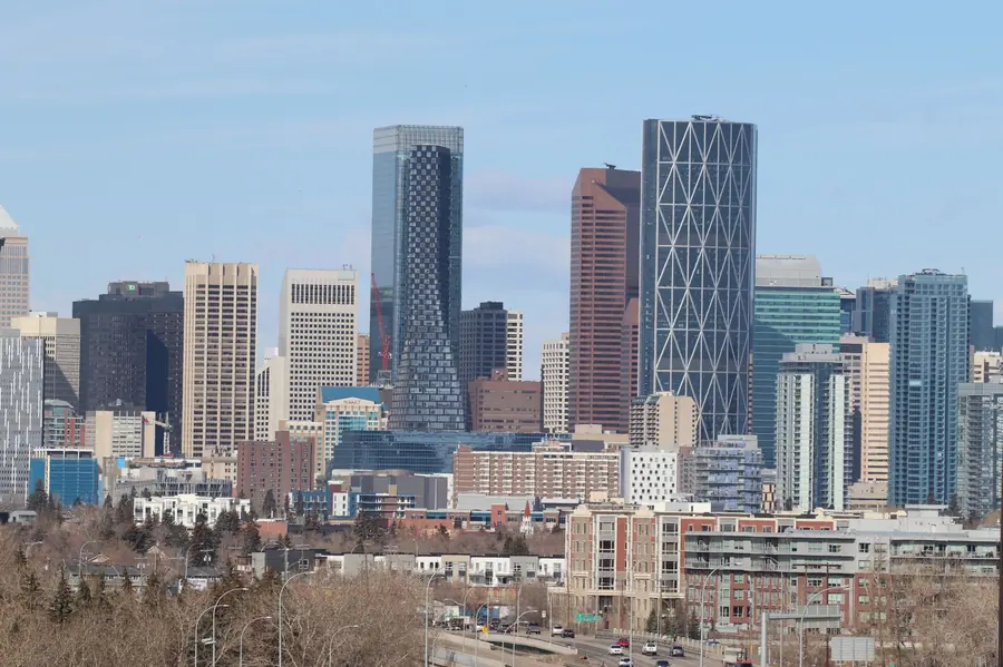 Calgary’s downtown towers on a clear spring day, seen from the south with the Bow Building’s diagonal steel bracing in the centre